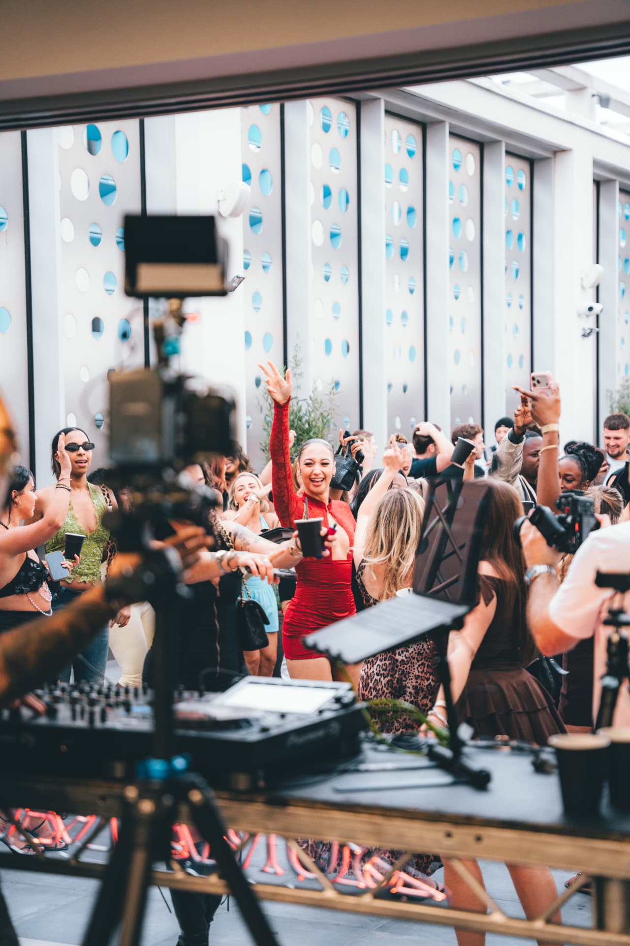SUMARA crowd gathered around a rooftop DJ booth